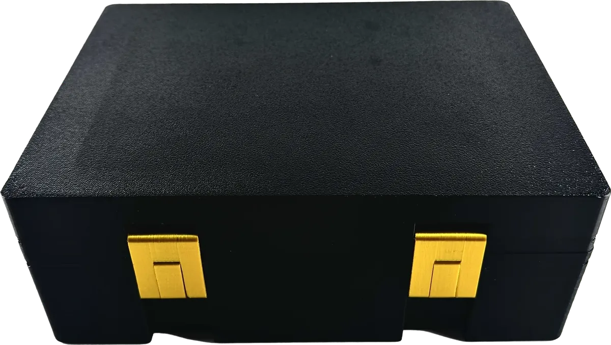 Black vial box with gold latches, closed